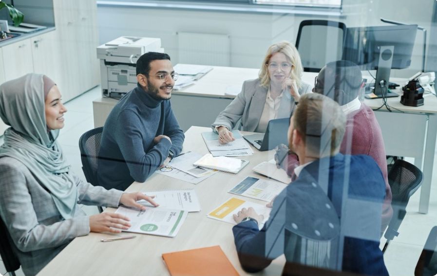 Leaders discussing a case study around a meeting table